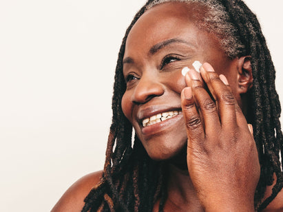 woman applying face cream