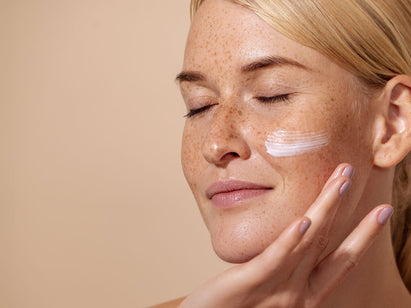 woman applying face cream