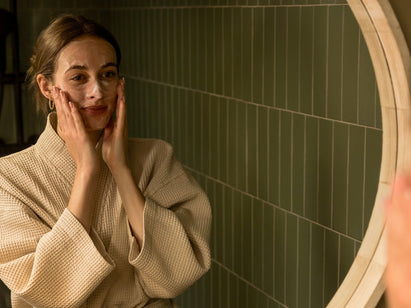 woman applying a face wash