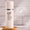 Age Defy+ Purify & Hydrate kremrens i hvit pumpeflaske på et trebrett med "dermatologisk testet"-merke.