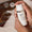 Hands hold the Age Defy+ Collagen Boost Vitamin C Serum bottle, highlighting its natural formula, antioxidants, and intense hydration.
